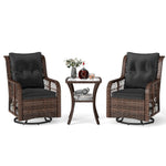 Two wicker chairs with black cushions and a matching side table on a white background