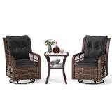 Two wicker chairs with black cushions and a matching side table on a white background